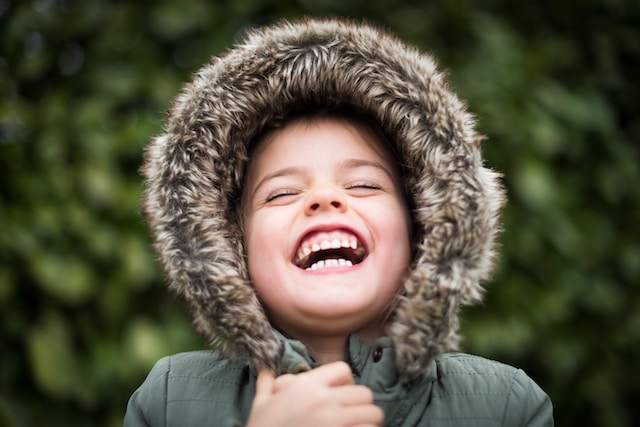 Little boy laughing with a big smile